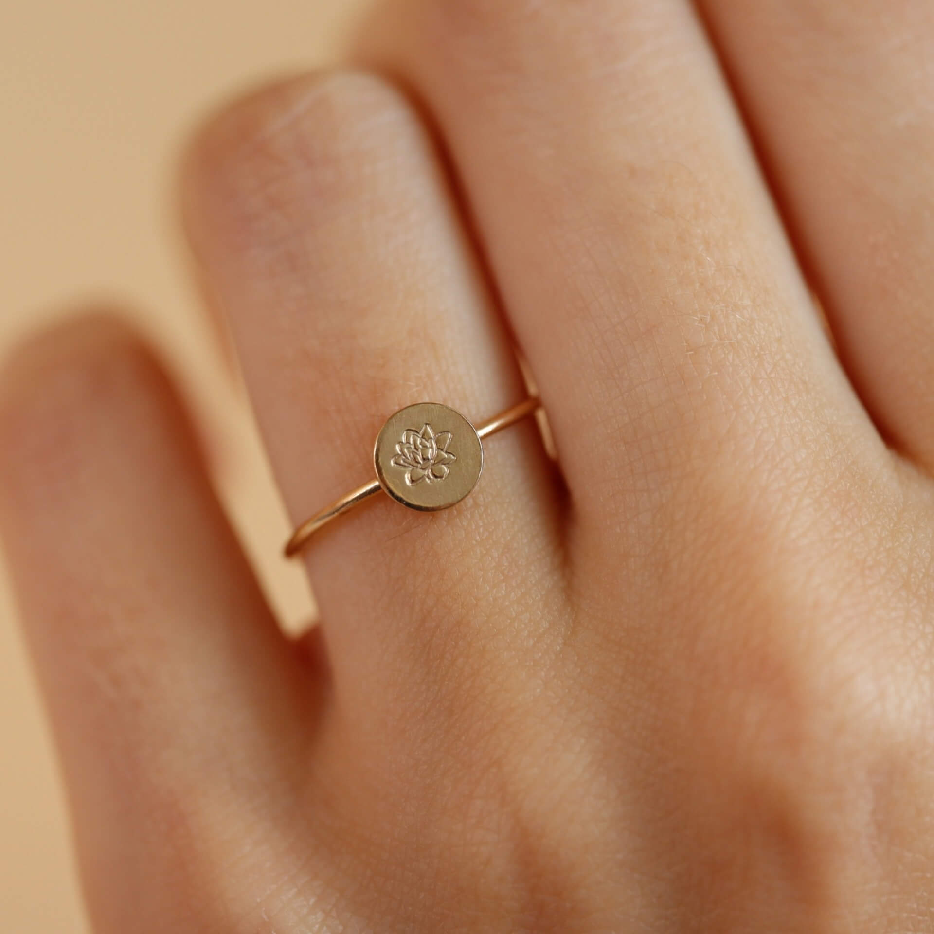 Birth flower ring featuring a Lotus flower for the month of August. Mother&#39;s Day Gifts, Personalized Jewelry, Handmade Jewelry, Gold Ring that&#39;s flower stamped by Token Jewelry in Eau Claire, WI