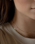 Model wearing 14k gold fill Clara chain paired with the dot and dash chain