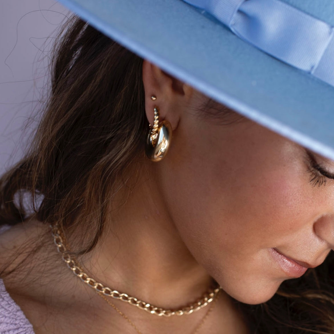 14k gold fill Cloud Hoops worn by a model