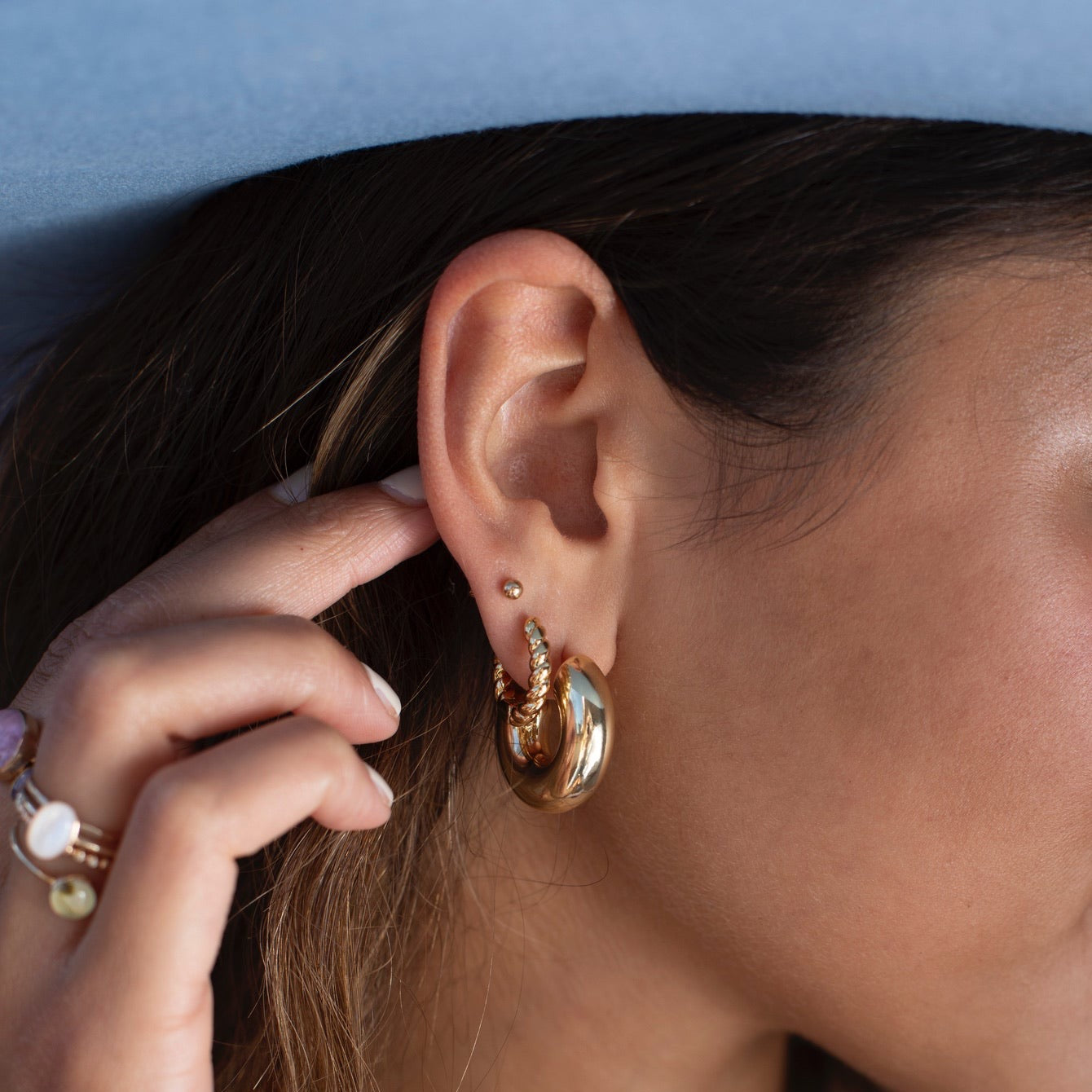 Model wearing 14k gold fill Cloud Hoops