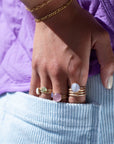 Model wearing 14k gold fill Pippa Ring on her middle finger.