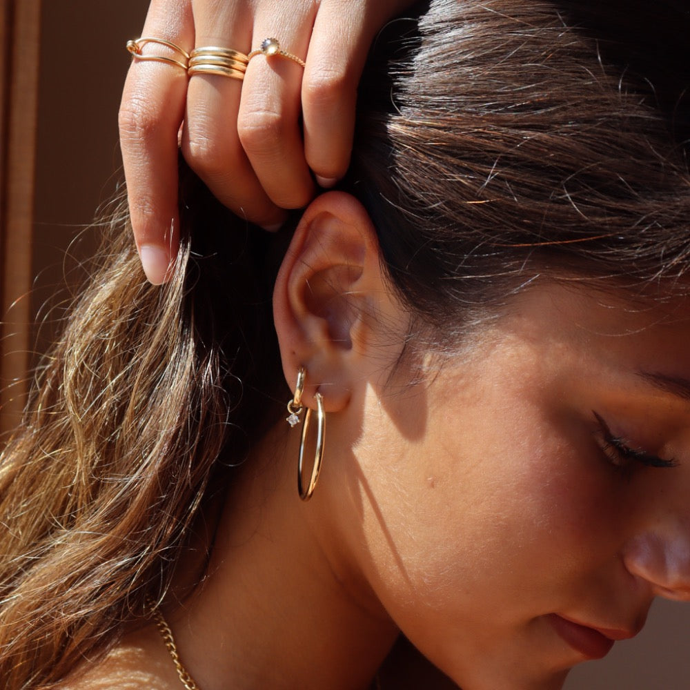 Model wearing 14k gold fill Quinn Hoops