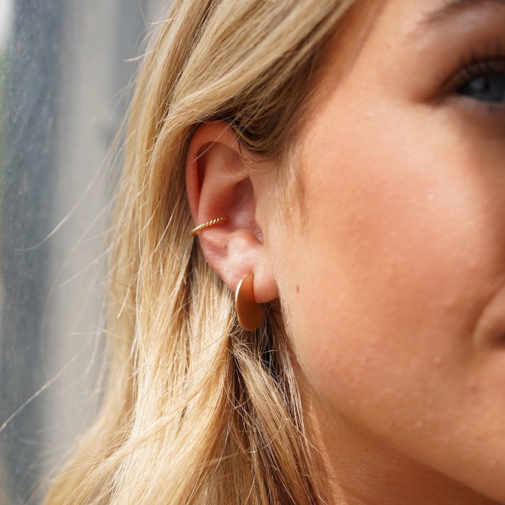 Model wearing 14k gold fill Spiral ear cuff