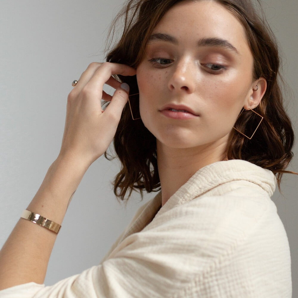 Model wearing 14k gold fill Square Hoops - Token Jewelry