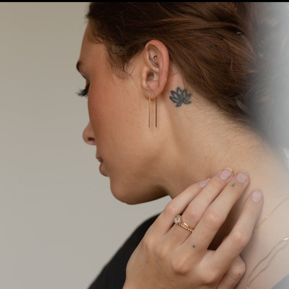 Model wearing 14k gold fill Staple earrings