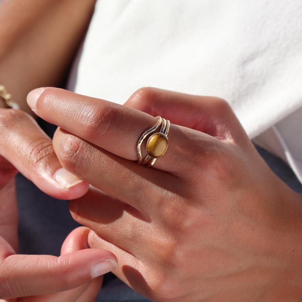 Model wearing 14k gold fill Plunge ring paired with the mesa ring and the tigers eye ring.