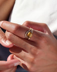 Model wearing 14k gold fill Plunge ring paired with the mesa ring and the tigers eye ring.