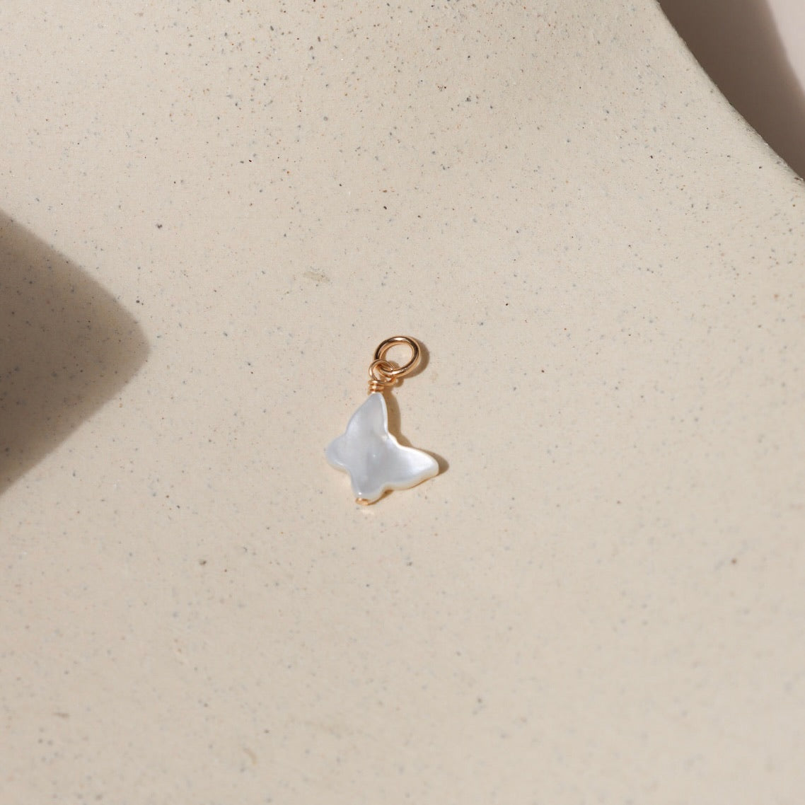 Genuine mother of pearl in a butterfly shape as a charm 