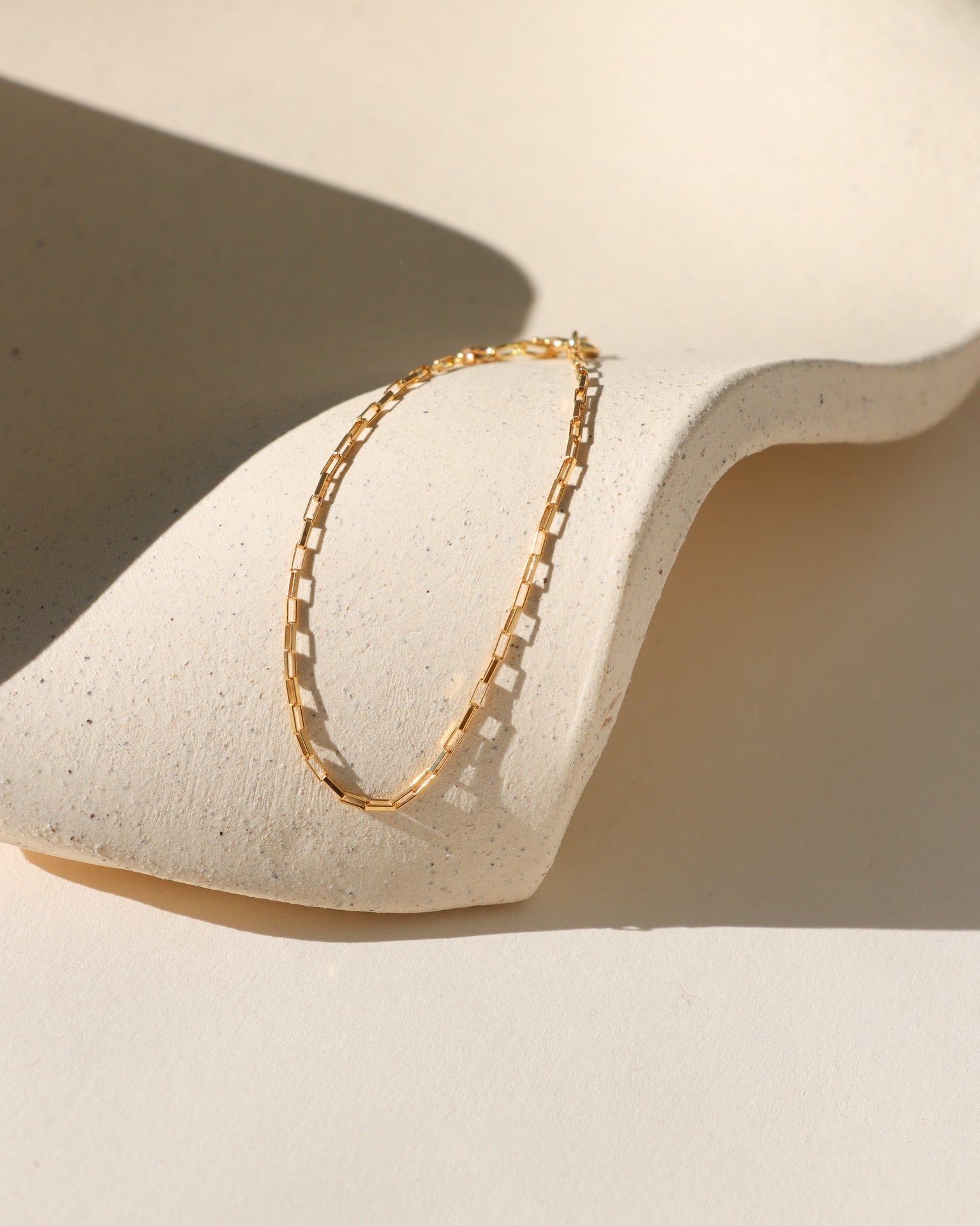  Nova Chain Bracelet in 14k gold fill or sterling silver, featuring a sleek box chain that reflects light with every movement
