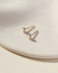 14k gold fill Opal Studs on a white plate