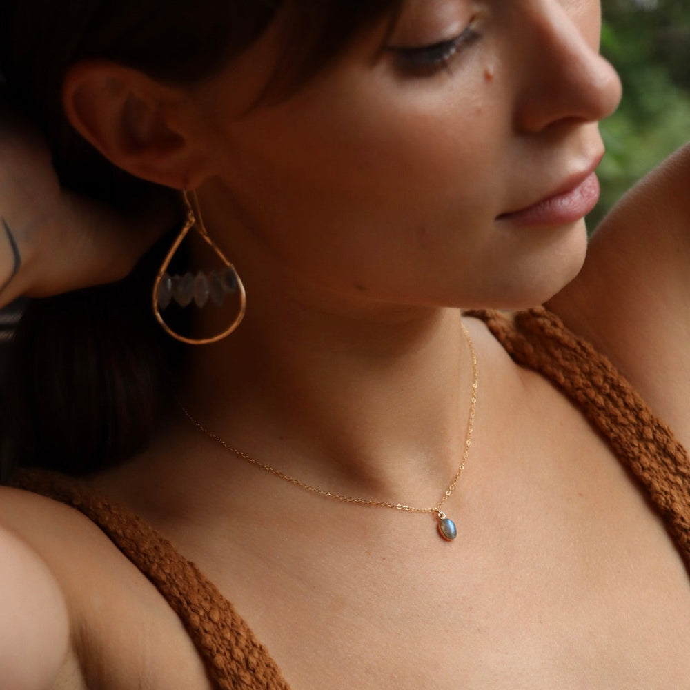 Minimal bezel-set labradorite pendant necklace on gold chain, handmade by Token Jewelry