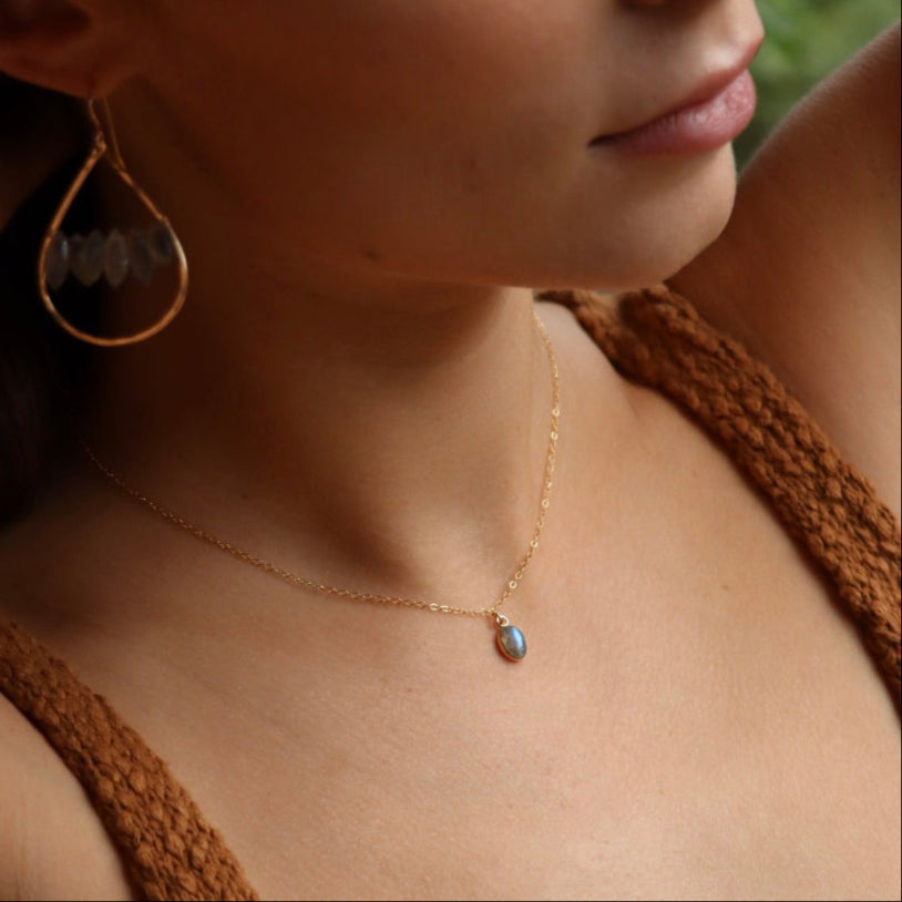 Minimal bezel-set labradorite pendant necklace on gold chain, handmade by Token Jewelry