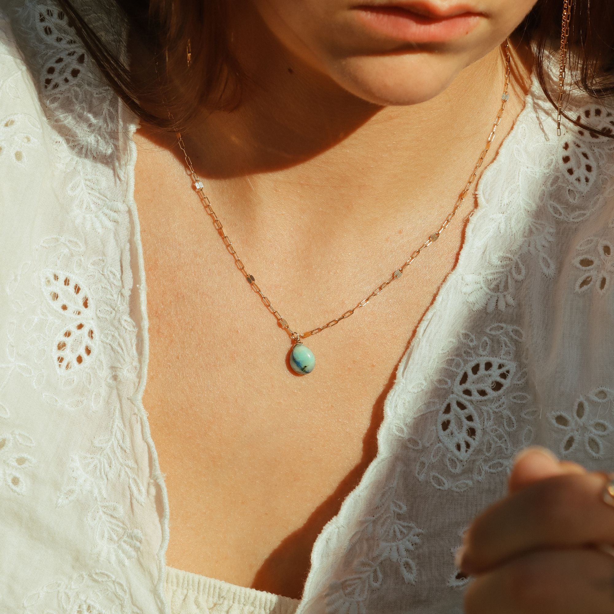 model wearing 14k gold fill chain necklace with teardrop azurite pendant