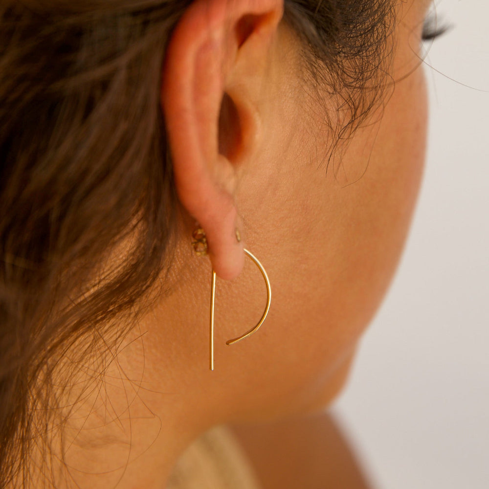 Model wearing 14k gold fill, P shaped threader earrings