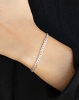 925 sterling silver cuban style chain link bracelet, worn by a model sporting a black sweater