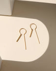 Token Jewelry’s Raya Keyhole Threaders — high-shine, handcrafted threader earrings in 14k gold fill or sterling silver with playful movement.
