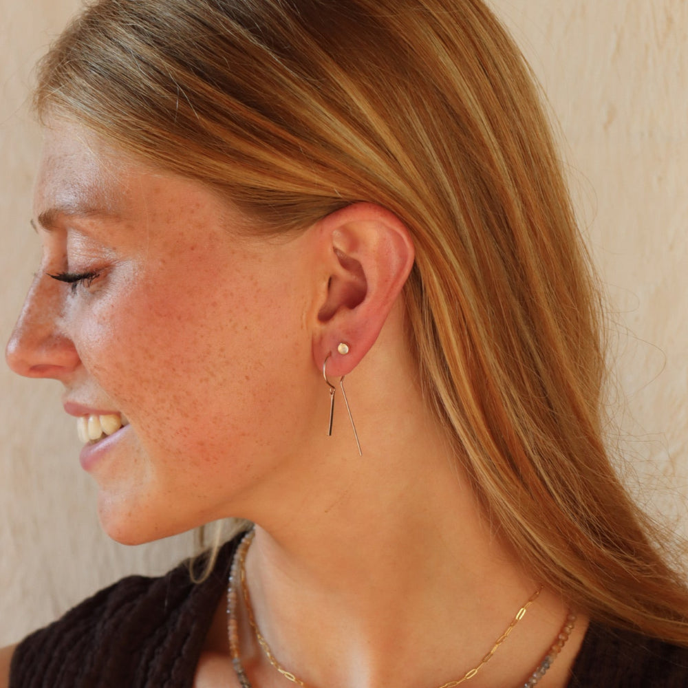 Token Jewelry’s Raya Keyhole Threaders — high-shine, handcrafted threader earrings in 14k gold fill or sterling silver with playful movement.