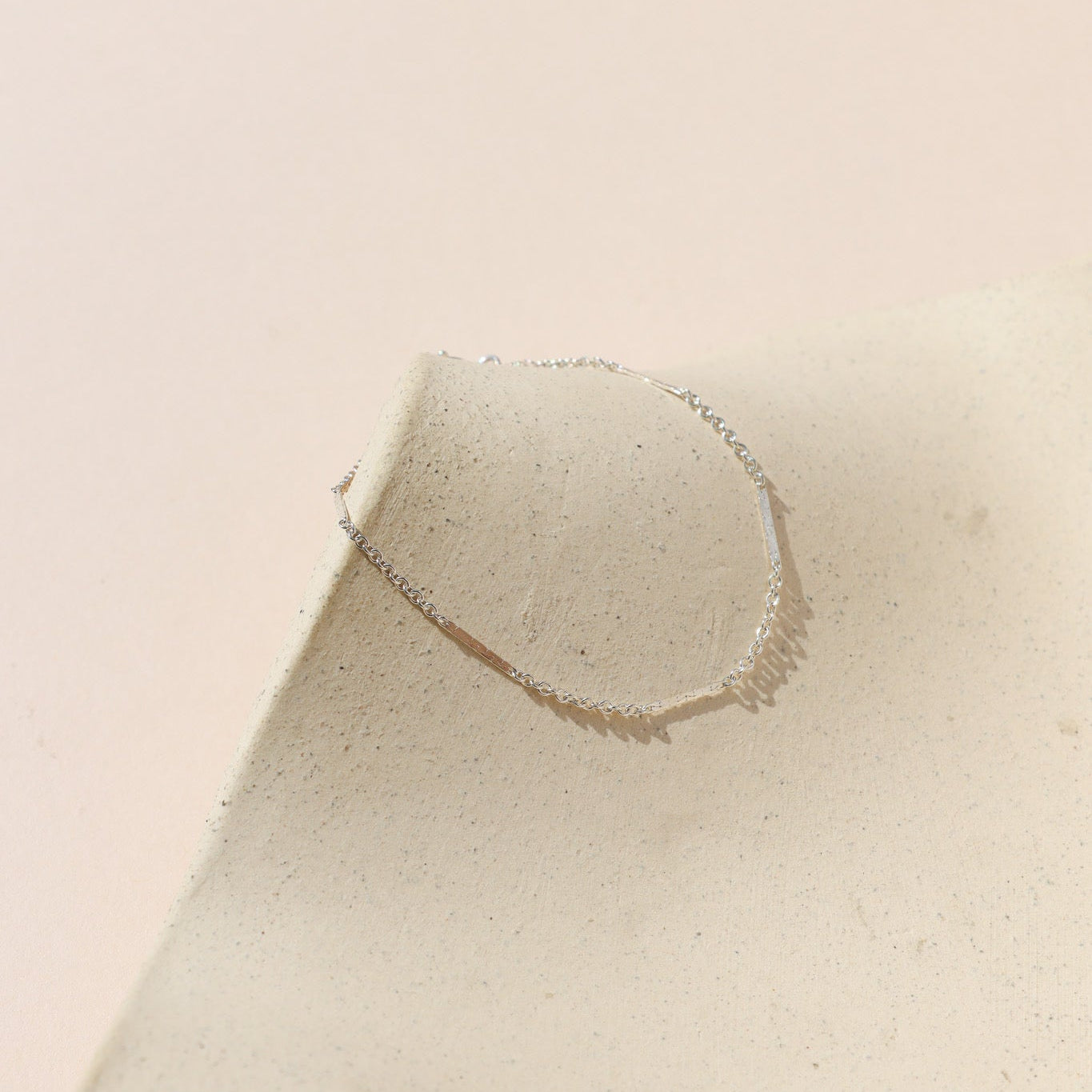 sterling silver sailor chain bracelet on a light dish