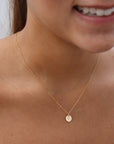 model wearing 14k gold fill dainty chain necklace with hand stamped circle charm