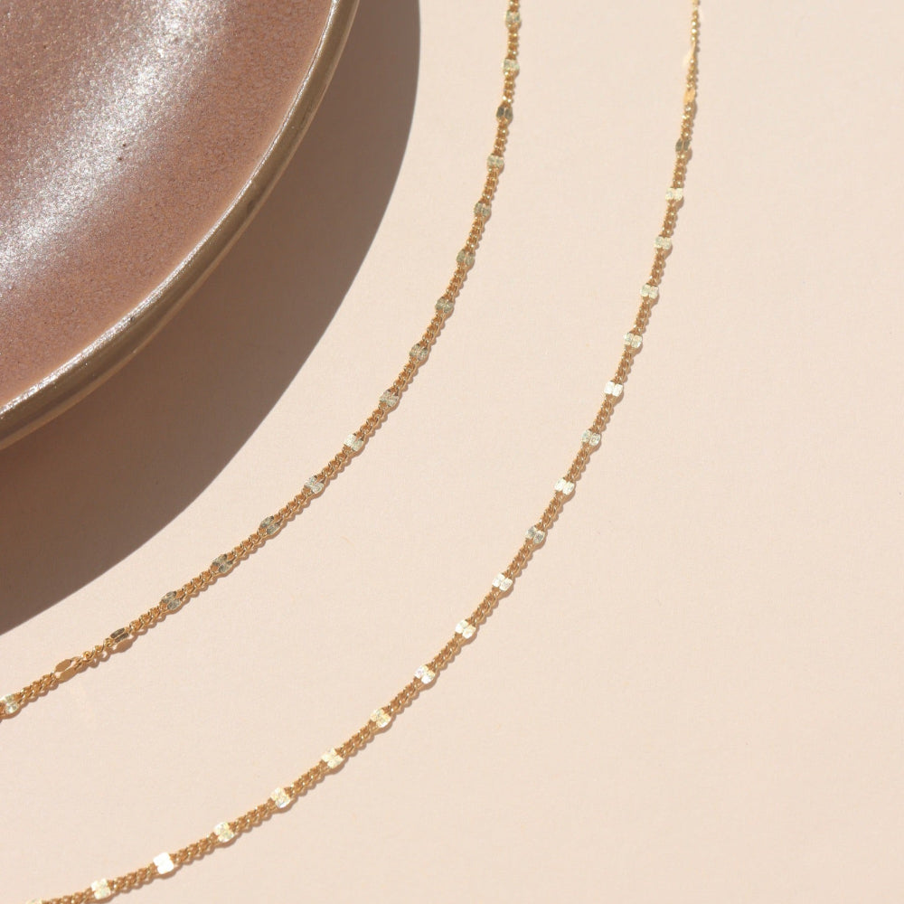 14k gold fill lip chain sparkling in natural sunlight