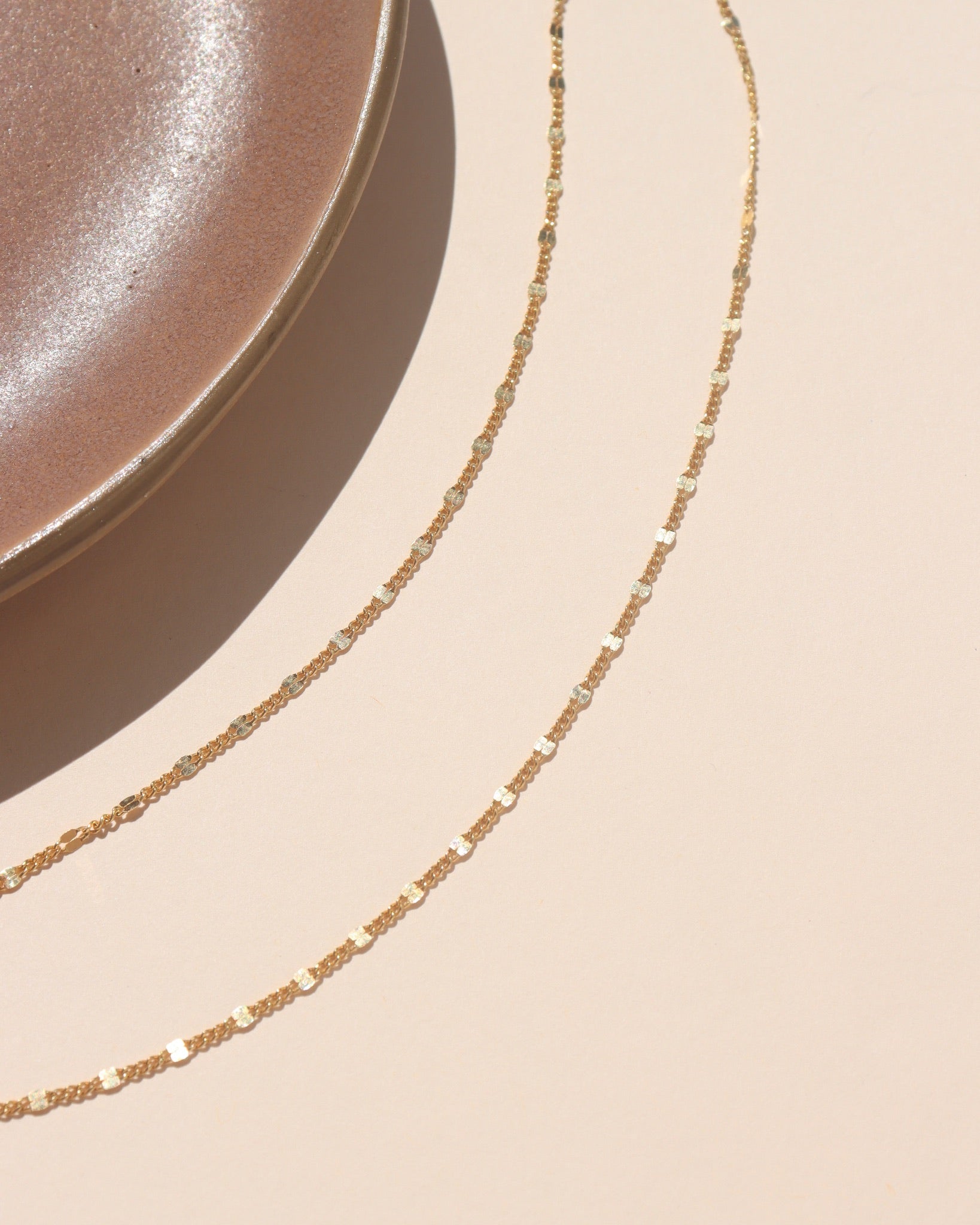 14k gold fill lip chain sparkling in natural sunlight