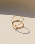 14k gold fill Sundari Ring laid on a tan plate in the sunlight