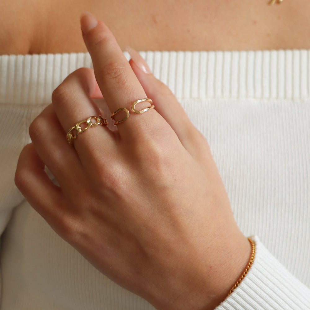 model wearing 14k gold fill sculptural hammered ring and chain ring