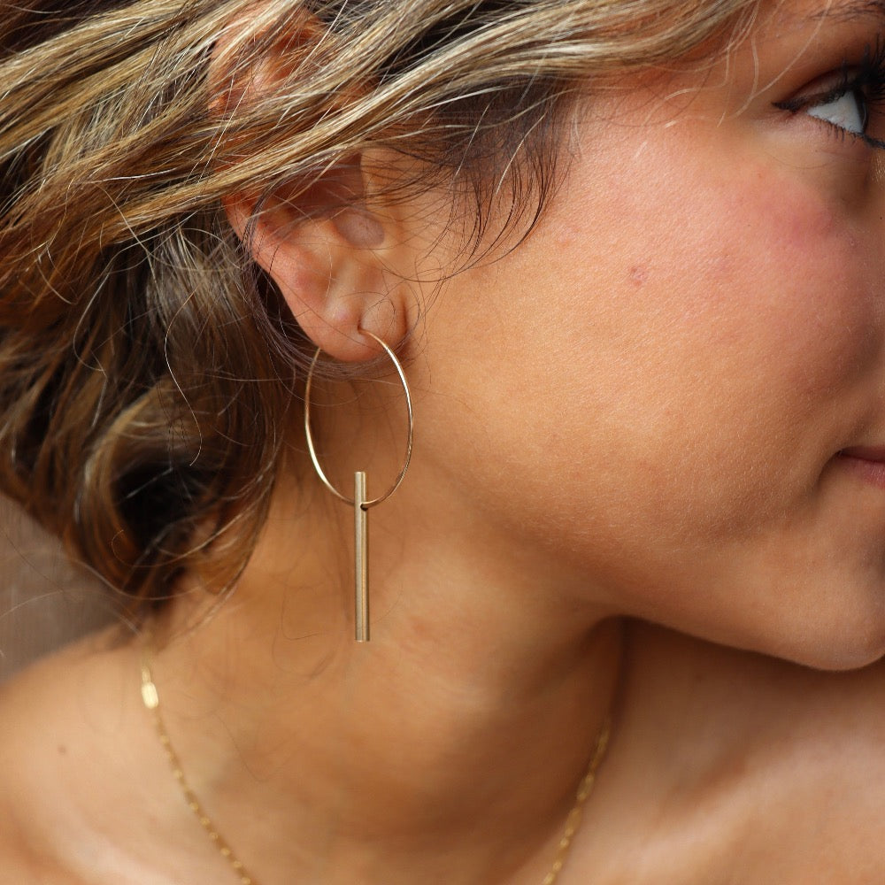 Model Wearing 14k gold fill Tunnel hoops 