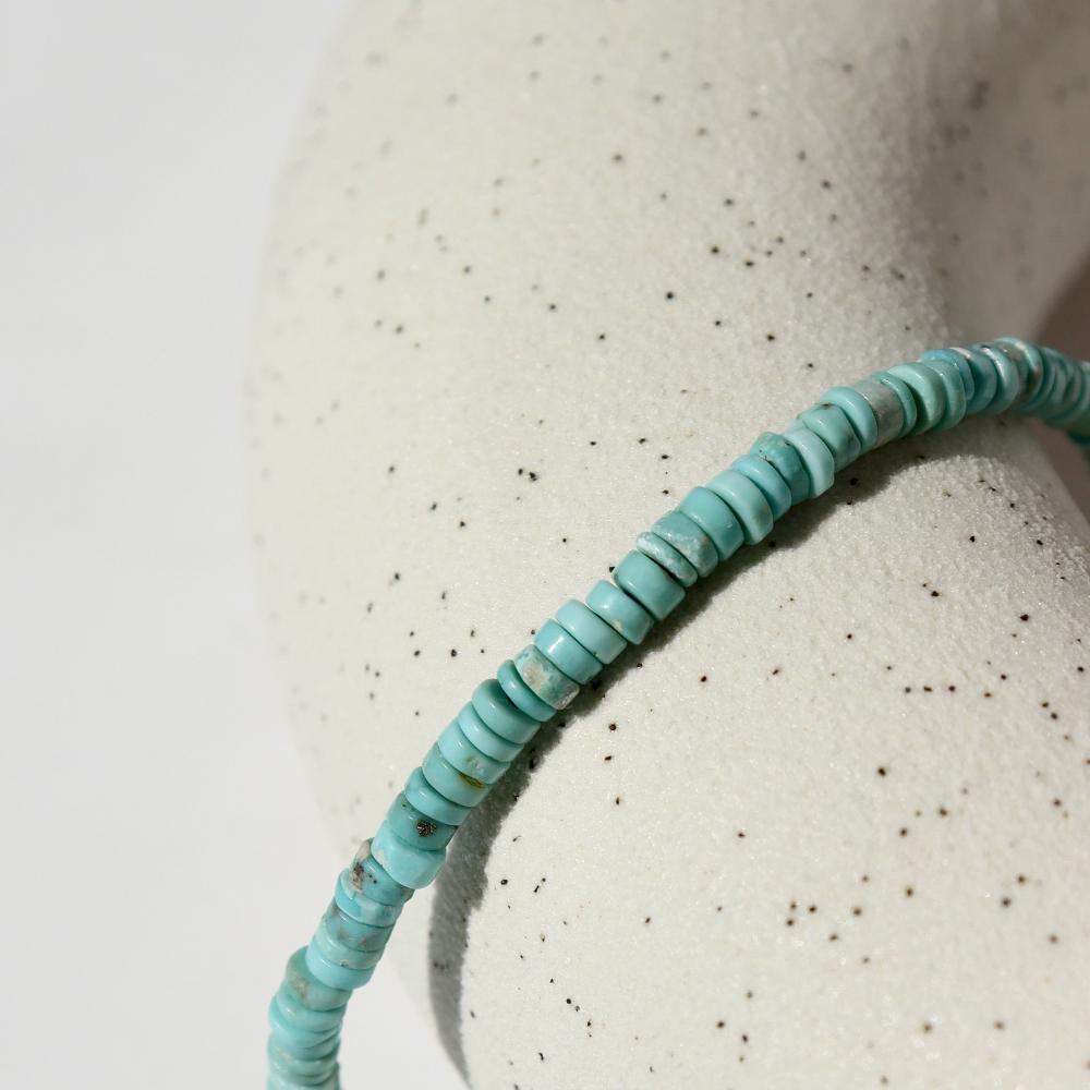 Turquoise Beaded Bracelet on a white plate