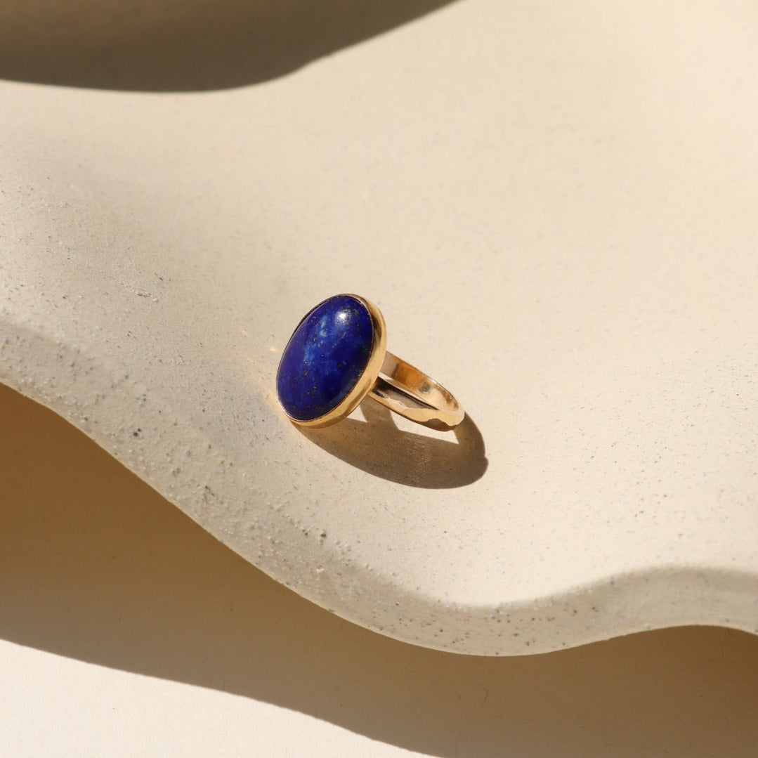 Twilight Lapis Ring resting on a ceramic dish.