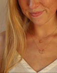 model wearing 14k gold fill hammered pendant on a 14k gold fill dainty necklace chain