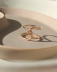 14k gold fill ring on a tan colored plate. handmade in Eau Claire Wisconsin.