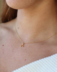 Model wearing 14k gold fill Wishbone Necklace.