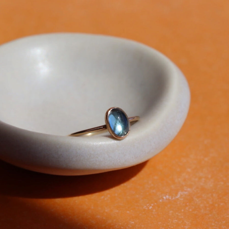 Blue Topaz Oval Ring - Oval cut blue topaz gemstone handset in an oval bezel. Shown in 14k gold fill. Also available in Sterling Silver. By Token Jewelry in Eau Claire, WI Gemstone Jewelry