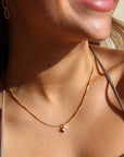 Model wearing 14k gold fill Quinn necklace.