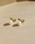 delicate handmade pearl drop stud earrings. made by Token Jewelry in Eau Claire, wisconsin
