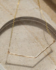 Modern geometric necklace hand hammered in 14k gold fill or sterling silver. Handmade by Token Jewelry in Eau Claire, WI  Edit alt text
