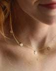 Model wearing 14k gold fill suncatcher necklace - 14k gold fill - minimal classic stacking or layering necklace - locally handmade in our studio in Eau Claire, WI - Token Jewelry
